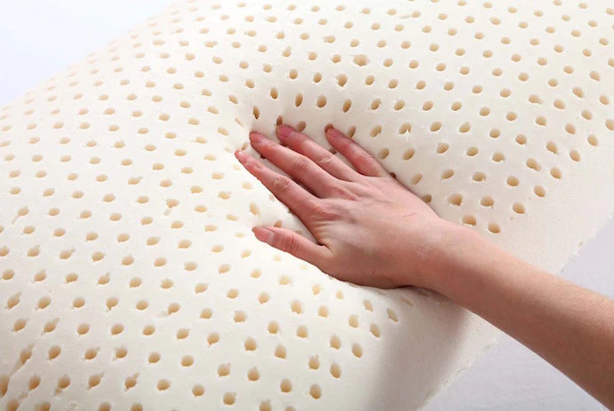 Close-up of natural Talalay latex pillow texture – ventilated pinhole design for airflow and comfort, eco-friendly and non-toxic
