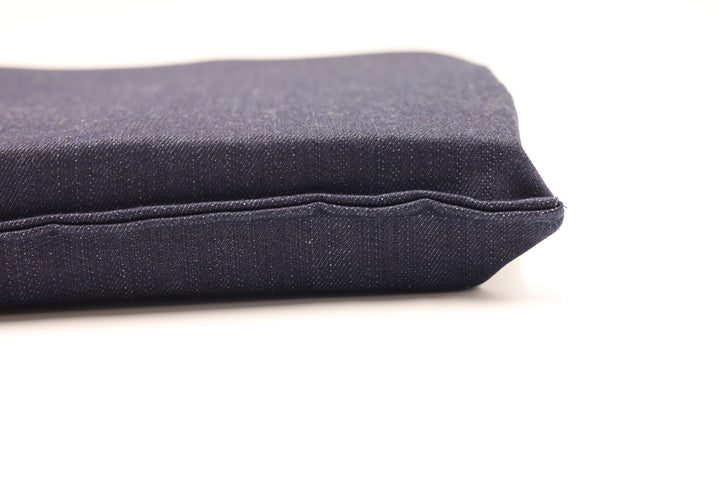 Close up view of seat cushion with dark blue denim cotton covered with no zipper